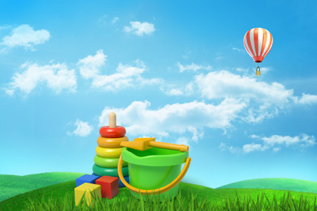 Toys and hot air balloon in a grass fieldの写真素材