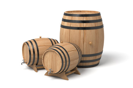 Three wooden barrels, varying sizes, isolated on whiteの写真素材