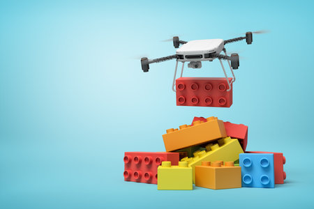 3d rendering of quadcopter delivering huge red toy block and putting it on pile of other blocks on blue background.の写真素材