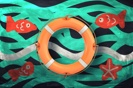 Lifebuoy and fishes in ocean wavesの写真素材