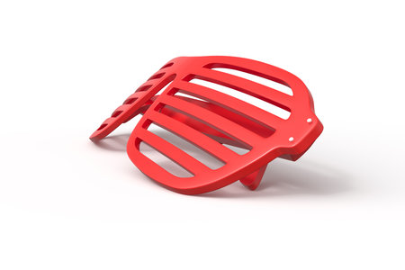 Red plastic stool overturned on white backgroundの写真素材