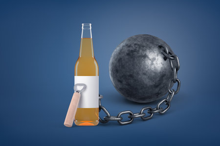 Beer bottle chained to a heavy ballの写真素材