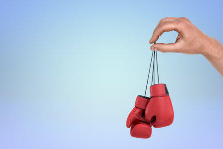 Hand with puppeteer motion over boxing glovesの写真素材