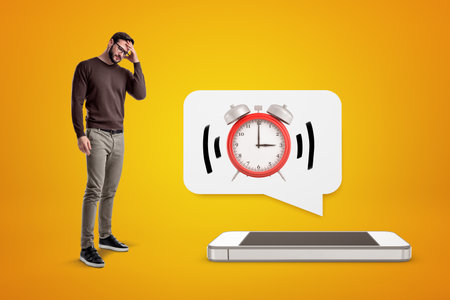 Man covering eyes, alarmed alarm clock from phone