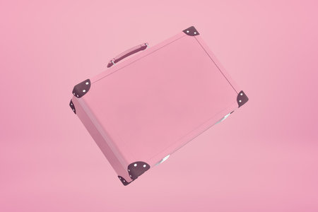 3d rendering of pastel pink suitcase with copy space floating on pastel pink background.の写真素材