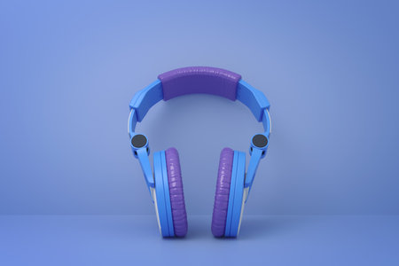 Headphones against a blue background with copy spaceの写真素材