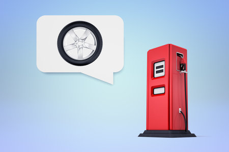 Car tire in speech bubble above gas pumpの写真素材