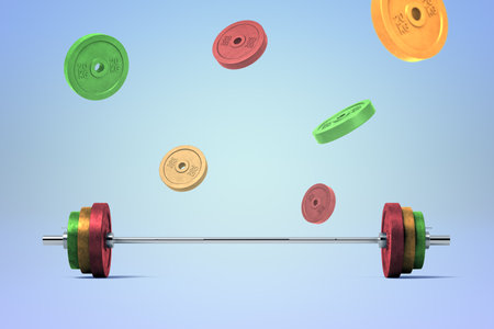 Colorful weight plates flying around barbellの写真素材