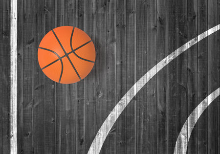 Basketball ball on wooden floor with court linesの写真素材