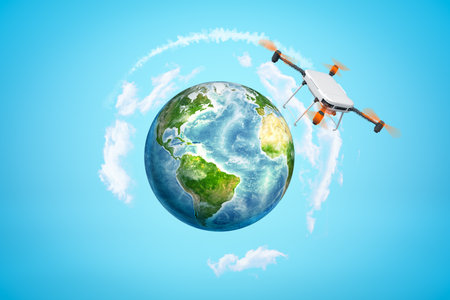 3d rendering of camera drone that is flying above Earth sphere which is far in distance in blue sky.の写真素材