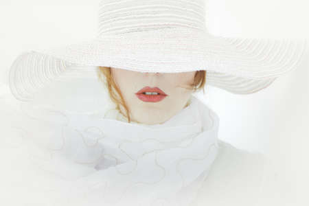 Woman in white and carmineの写真素材