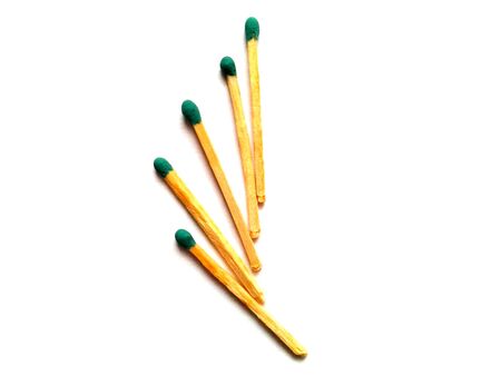 Matches with a green fiery head. Isolated background. Laid out in the form of a wing. Getting open...