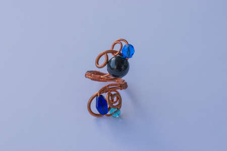Unique handmade jewelry made of copper wire and colourful stones. Taken in the Golden City of Pforzheim, Germanyの写真素材