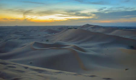 Endless desert sand dunes at sunset near Abu Dhabi, United Arab Emiratesの写真素材