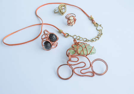 Unique handmade jewelry made of copper wire and colourful stones. Taken in the Golden City of Pforzheim, Germanyの写真素材