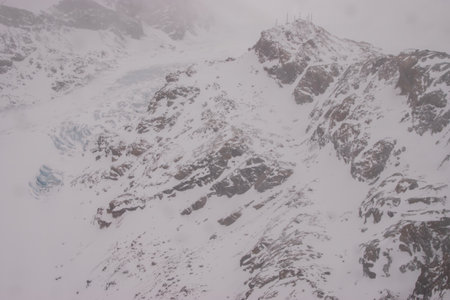 Snow-covered glaciers and snow-covered mountain peaks in Zermatt ski resort in Switzerlandの写真素材