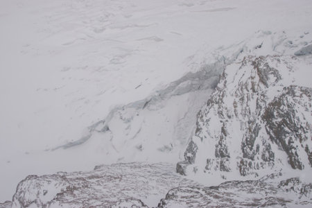 Snow-covered glaciers and snow-covered mountain peaks in Zermatt ski resort in Switzerlandの写真素材