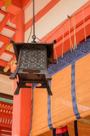 Japanese lanterns are traditional lighting devices made from materials like paper, silk, or metal, often framed with bamboo or wood. They are used for both indoor and outdoor decoration, creating a warm, ambient glow in various settings.の写真素材