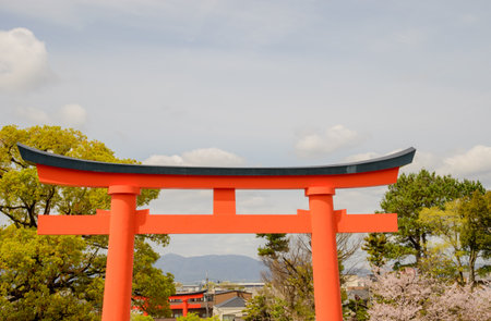 A torii is an iconic gate in Japan, marking the entrance to a sacred space, symbolizing the boundary between the sacred and the profane.の写真素材