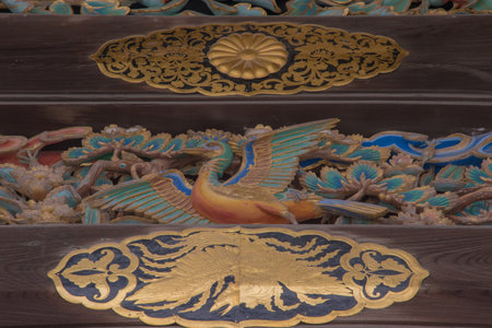 Wooden structures are enhanced with golden crane motifs and metalwork, showcasing symbolic nature-inspired elegance and historical grandeur.の写真素材