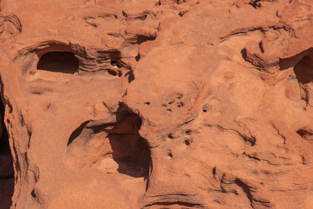 The Namibian desert is home to scattered brown stones and rugged rock formations shaped by natural processes over millennia.の写真素材