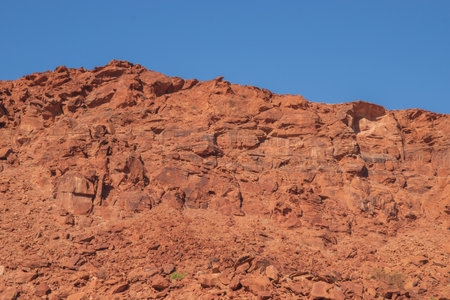 The Namibian desert is home to scattered brown stones and rugged rock formations shaped by natural processes over millennia.の写真素材