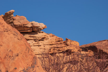 The Namibian desert is home to scattered brown stones and rugged rock formations shaped by natural processes over millennia.の写真素材