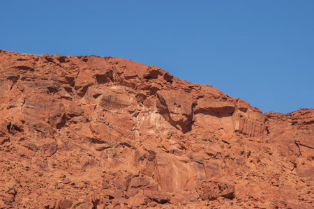 The Namibian desert is home to scattered brown stones and rugged rock formations shaped by natural processes over millennia.の写真素材