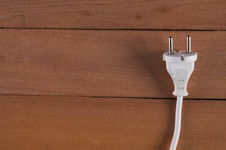 Energy, Electricity, Electric Plug on wooden backgroundの写真素材