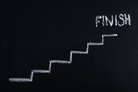 drawing with chalk career stairs with finish on chalkboardの写真素材