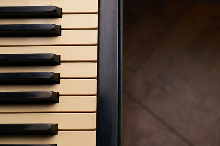 Vintage old piano keyboard, close up with copy spaceの写真素材