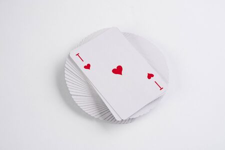 Close up of playing cards poker game with ace of hearts on white backgroundの写真素材