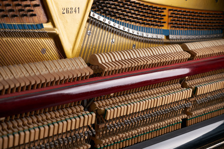 Close up of mechanics inside of an upright pianoの写真素材