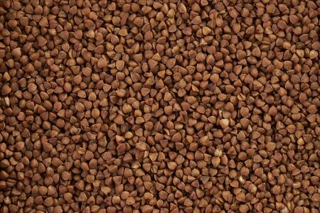 Ãï¿½uckwheat grains closeup top view background. Healthy foodの写真素材