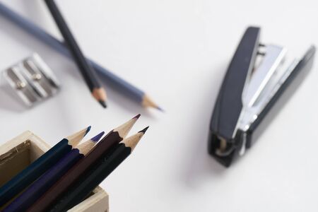 Office stationery. Pencil box, stapler and pencil sharpener on white backgroundの写真素材