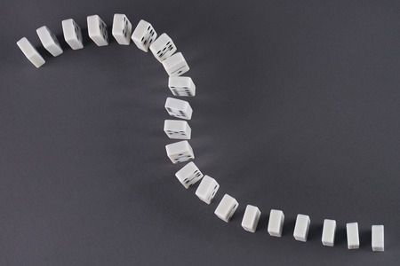 White domino play pieces on blue backgroundの写真素材