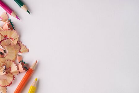 Pencil sharpener shavings on white background. Back to school. Copy space, top viewの写真素材
