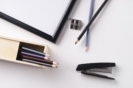 Office stationery. Pencil box, stapler and pencil sharpener on white backgroundの写真素材