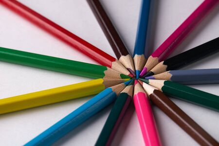 Circle of colorful pencils on white background. Close up shotの写真素材