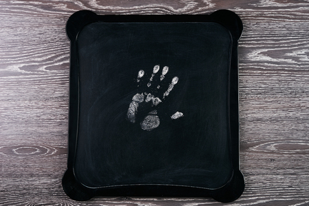 Handprint on chalkboardの写真素材