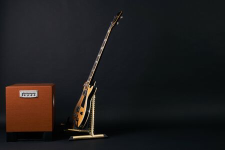 Combo amplifier for guitar with bass guitar on the black background with copy spaceの写真素材