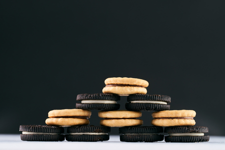 Pyramid of wheat round biscuits on dark backgroundの写真素材