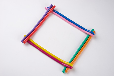 Picture frame made from color plasticine isolated on white background with copy space.の写真素材