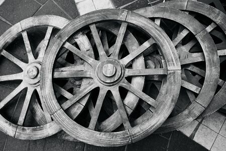 Old rustic wooden wagon wheels. Black and whiteの写真素材