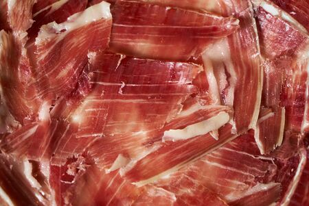 Close-up of best quality sliced prosciutto meat.の写真素材