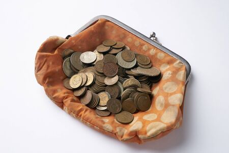Old retro,vintage woman wallet with old collection coins isolated on white background.