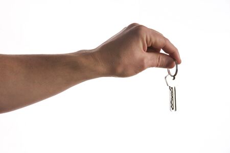 Keys in hand isolated on white