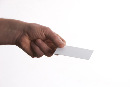 Businessman holding business card with copy space isolated on white backgroundの写真素材