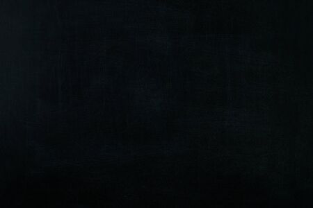 Blackboard / chalkboard texture for background. Empty blank black chalkboard with chalk tracesの写真素材