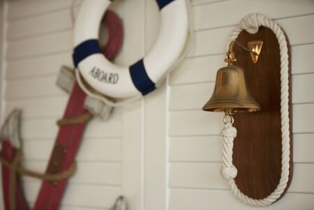 Composition on the marine theme with anchor, paddle and lifeline on old wooden backgroundの写真素材